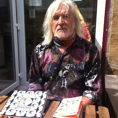 David Hall, illustrator, with his book about Puffins